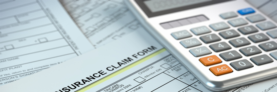 Insurance claim forms and a calculator